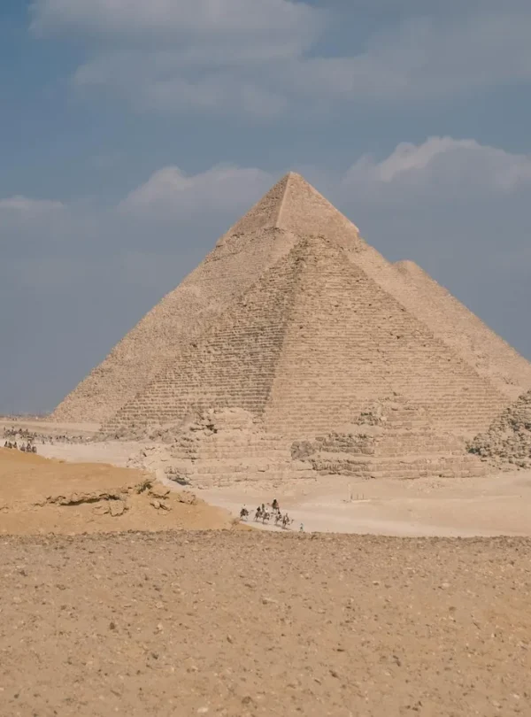 Stunning daytime view of the iconic Great Pyramid of Giza under a clear sky.