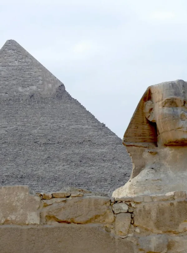 The iconic Great Pyramid and Sphinx of Giza captured on a clear day, highlighting ancient Egyptian architecture.