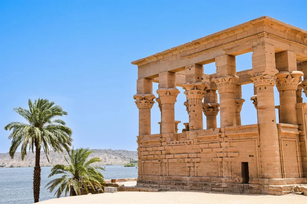 Explore the majestic ruins of an ancient temple by the Nile in Aswan, Egypt.