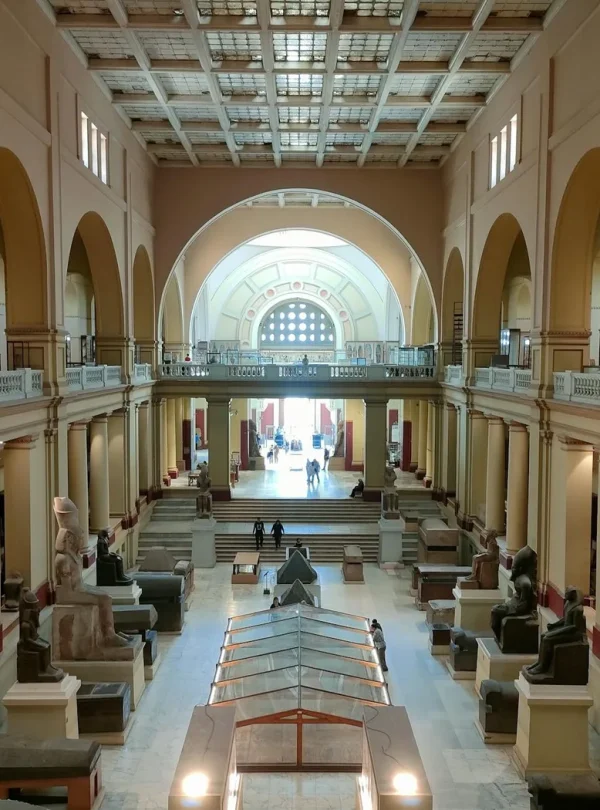 Wide view of the Egyptian Museum's main hall showcasing ancient sculptures and architecture.