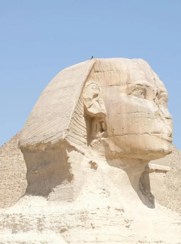 Capture of the iconic Great Sphinx and Pyramid under clear skies.