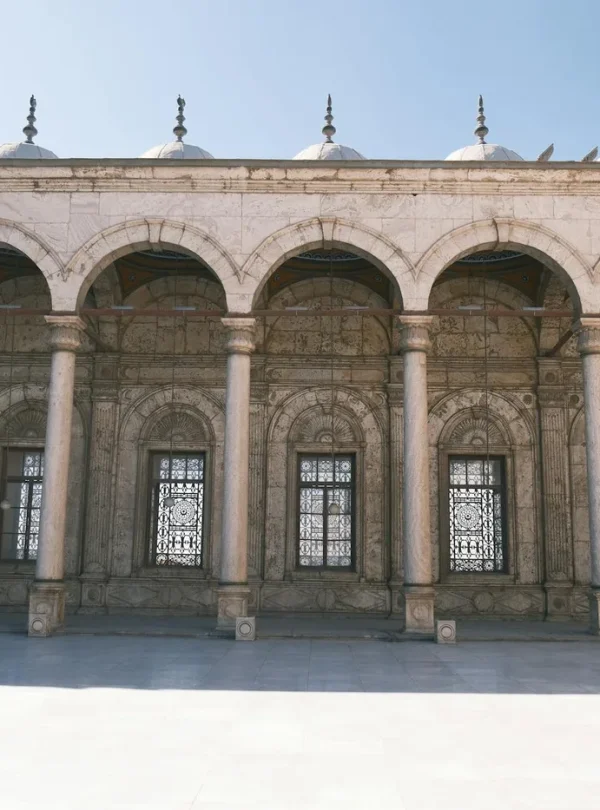A stunning view of the intricate arches of a historic mosque in Cairo, Egypt.