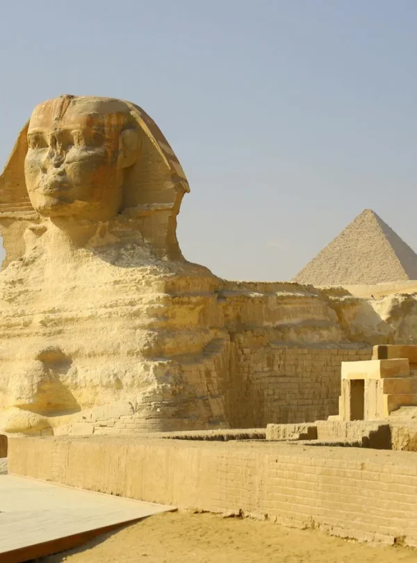 The iconic Great Sphinx and Pyramid of Giza captured on a sunny day.