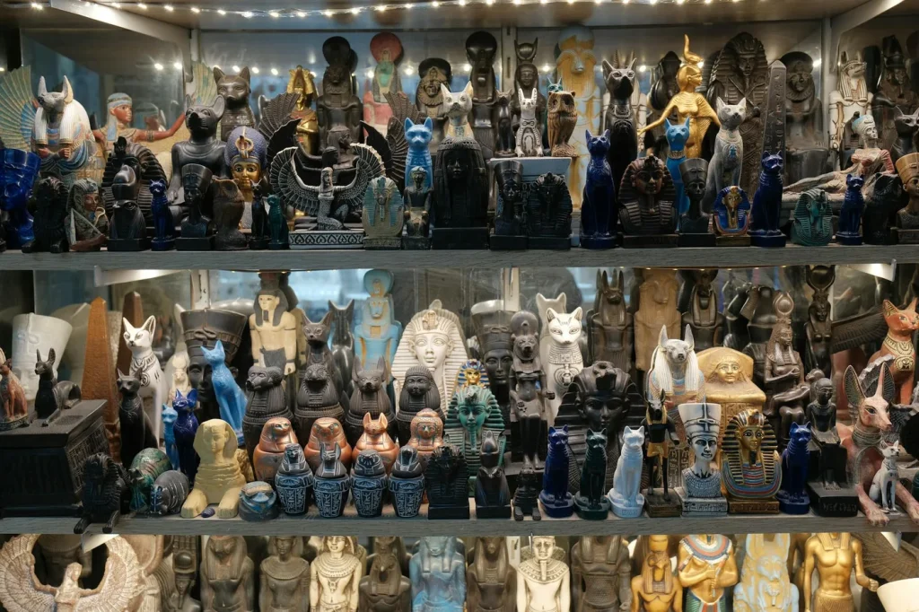 Vibrant display of Egyptian statues and artifacts showcasing pharaohs, gods, and ancient artifacts.