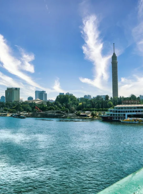 Stunning daytime view of Cairo skyline featuring the Nile River and Cairo Tower.